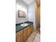 Bathroom with wood cabinets and green countertop at 3246 E 5 E Hwy, Carrollton, GA 30116