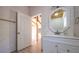 Bright bathroom with white vanity and octagon mirror at 3246 E 5 E Hwy, Carrollton, GA 30116