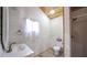 Small bathroom with shower, toilet, and white wood paneling at 3246 E 5 E Hwy, Carrollton, GA 30116