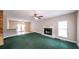 Spacious living room with fireplace and green carpet at 3246 E 5 E Hwy, Carrollton, GA 30116