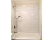 Updated bathroom with marble-look tile and a new bathtub at 3464 Creatwood Se Trl, Smyrna, GA 30080