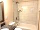 Updated bathroom with a bathtub and marble tile at 3464 Creatwood Se Trl, Smyrna, GA 30080