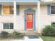 Attractive brick home featuring a red front door and blue accents at 3464 Creatwood Se Trl, Smyrna, GA 30080