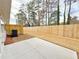 Well-maintained backyard featuring a concrete patio and a wooden fence for privacy at 5435 Rock Place Ct # 38, Norcross, GA 30093