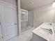 Modern bathroom with a double sink vanity, and a glass-enclosed shower at 5435 Rock Place Ct # 38, Norcross, GA 30093