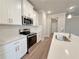 Kitchen with stainless steel oven, microwave, subway tile backsplash and quartz countertops at 5435 Rock Place Ct # 38, Norcross, GA 30093