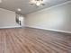 Expansive living room showcasing wood-look flooring and neutral color palette at 5435 Rock Place Ct # 38, Norcross, GA 30093