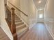 Stylish staircase with carpeted steps and decorative iron railing, leading to the upper level at 5435 Rock Place Ct # 38, Norcross, GA 30093