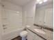 Clean bathroom featuring a shower/tub combo and granite countertop at 80 Heyman Dr, Covington, GA 30016