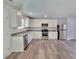 Modern kitchen with stainless steel appliances and granite countertops at 80 Heyman Dr, Covington, GA 30016