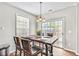 Charming dining area with wooden table and sliding glass doors to patio at 2942 War Party Ct, Douglasville, GA 30135