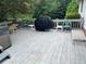 Spacious back deck features a grill, multiple chairs, and views of the private backyard at 850 Thurman Rd, Stockbridge, GA 30281