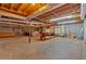 Unfinished basement area featuring exposed ceiling, concrete flooring and storage solutions at 850 Thurman Rd, Stockbridge, GA 30281
