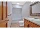 Full bathroom featuring a shower-tub combo, toilet and vanity with a framed mirror at 850 Thurman Rd, Stockbridge, GA 30281