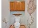 Powder room featuring a decorative shelf, cabinet, and an ornate decoration at 850 Thurman Rd, Stockbridge, GA 30281