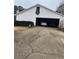 Spacious garage with parked cars, providing secure parking and storage space, plus a driveway at 850 Thurman Rd, Stockbridge, GA 30281