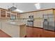 Spacious kitchen featuring a stainless-steel refrigerator and modern appliances at 850 Thurman Rd, Stockbridge, GA 30281