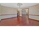 Open living room with hardwood floors and decorative wallpaper at 850 Thurman Rd, Stockbridge, GA 30281