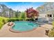 Backyard pool with jacuzzi and surrounding greenery at 850 Thurman Rd, Stockbridge, GA 30281