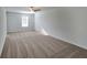 Spacious bedroom with carpeted floors and a window with blinds at 140 Tye St, Stockbridge, GA 30281