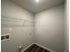 Laundry room with built-in shelving and floor-to-ceiling cabinets at 142 Tye St, Stockbridge, GA 30281