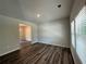 Spacious living room featuring vinyl plank flooring and neutral walls at 142 Tye St, Stockbridge, GA 30281