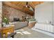 Bright bedroom with workspace and exposed brick accent wall at 170 Boulevard Se # H401, Atlanta, GA 30312