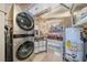 Stackable washer and dryer in a well-organized laundry area at 170 Boulevard Se # H401, Atlanta, GA 30312