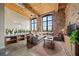 Spacious living room with exposed brick and large windows at 170 Boulevard Se # H401, Atlanta, GA 30312