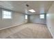 Finished basement with neutral carpeting and exterior access at 532 Greg Sw Dr, Lilburn, GA 30047