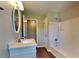 Bathroom with a tub, vanity, and updated fixtures at 532 Greg Sw Dr, Lilburn, GA 30047