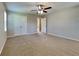 Spacious bedroom with ceiling fan and double-door closet at 532 Greg Sw Dr, Lilburn, GA 30047