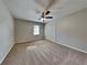 Spacious bedroom with ceiling fan and closet at 532 Greg Sw Dr, Lilburn, GA 30047