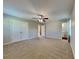 Large main bedroom with ceiling fan and double doors to closet at 532 Greg Sw Dr, Lilburn, GA 30047