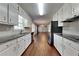 View of kitchen with granite countertops and stainless steel appliances at 532 Greg Sw Dr, Lilburn, GA 30047