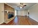 Spacious living room with built-in shelving and fireplace at 532 Greg Sw Dr, Lilburn, GA 30047