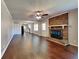 Living room with brick fireplace and hardwood floors at 532 Greg Sw Dr, Lilburn, GA 30047