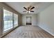 Bright living room featuring hardwood floors and a ceiling fan at 532 Greg Sw Dr, Lilburn, GA 30047