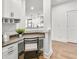 Built-in workspace with granite countertop and white cabinets at 5395 Julep Ct, Cumming, GA 30028