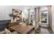 Bright dining room featuring a large wooden table and neutral decor at 5395 Julep Ct, Cumming, GA 30028