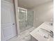 Modern bathroom with a tiled glass shower and double sink vanity at 5455 Rock Place Ct # 40, Norcross, GA 30093