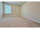 Bright bedroom with neutral carpet, blind-covered windows, and ample natural light at 5455 Rock Place Ct # 40, Norcross, GA 30093