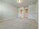 Neutral bedroom with carpet flooring, ample space, and access to ensuite bathroom at 5455 Rock Place Ct # 40, Norcross, GA 30093