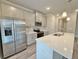 Bright kitchen featuring stainless steel appliances, white cabinets, and quartz countertops at 5455 Rock Place Ct # 40, Norcross, GA 30093