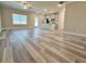 Expansive open-concept living space featuring gray floors, kitchen island, and abundant natural light at 5455 Rock Place Ct # 40, Norcross, GA 30093