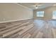 Spacious living area with gray floors, neutral walls, and abundant natural light at 5455 Rock Place Ct # 40, Norcross, GA 30093