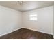 Well-lit bedroom featuring dark brown wood flooring at 205 Ridge Run, Stockbridge, GA 30281