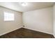 Spacious bedroom with dark brown wood flooring and window at 205 Ridge Run, Stockbridge, GA 30281