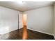 Bedroom with dark brown wood flooring and access to a hallway at 205 Ridge Run, Stockbridge, GA 30281