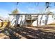 Rear view of house showcasing a deck and fenced backyard at 205 Ridge Run, Stockbridge, GA 30281